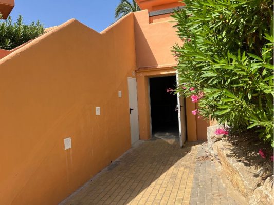 Area under steps blocked in for extra maintenance storage - Casares del Sol pm4